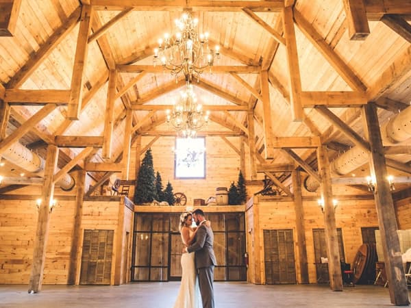wedding couple dancing in custom barn kit event venue